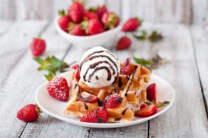 belgium waffles with strawberries ice cream white plate 1