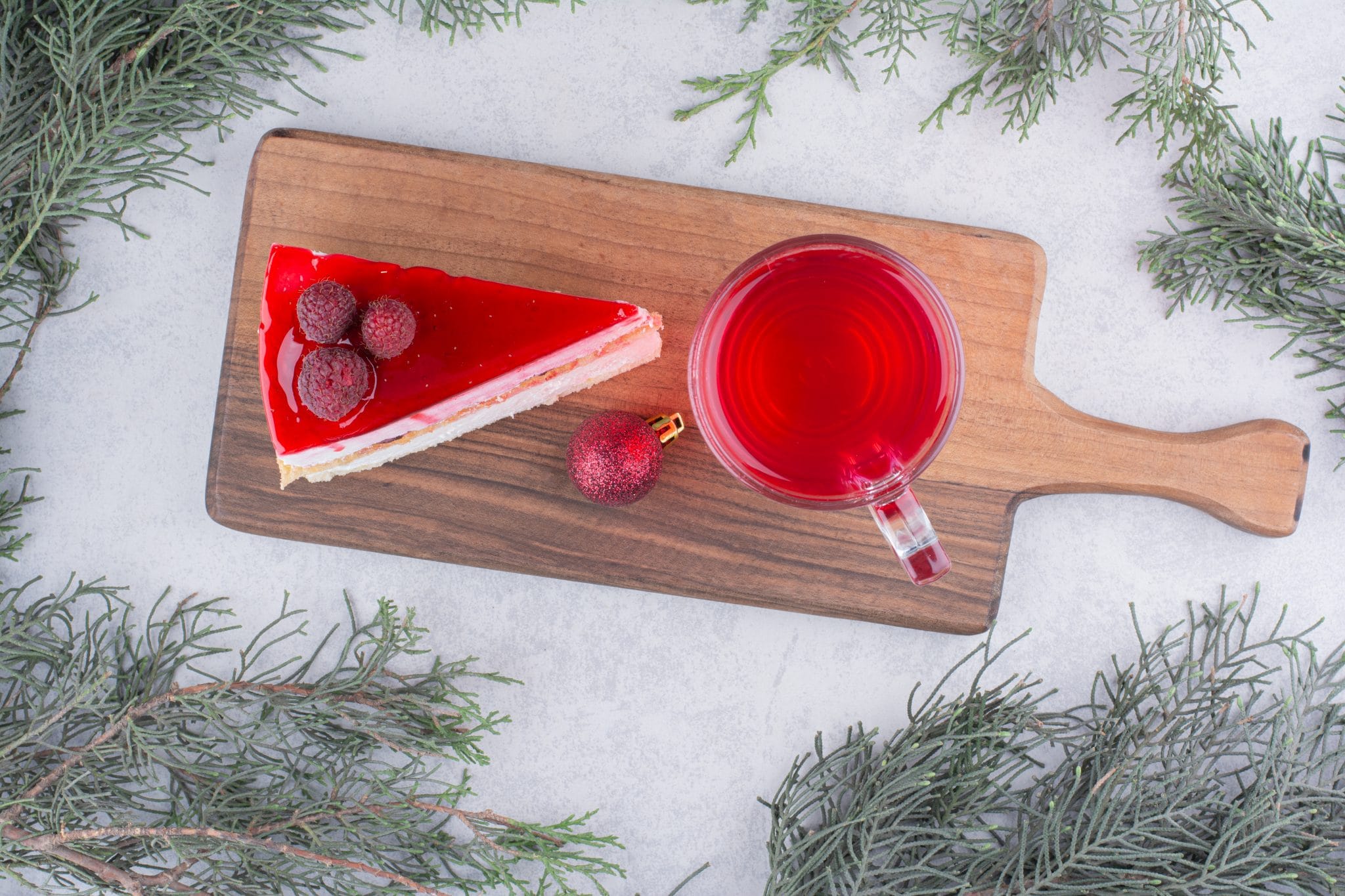 Cheesecake And Glass Of Tea On Wooden Board With Festive Decorations High Quality Photo Scaled
