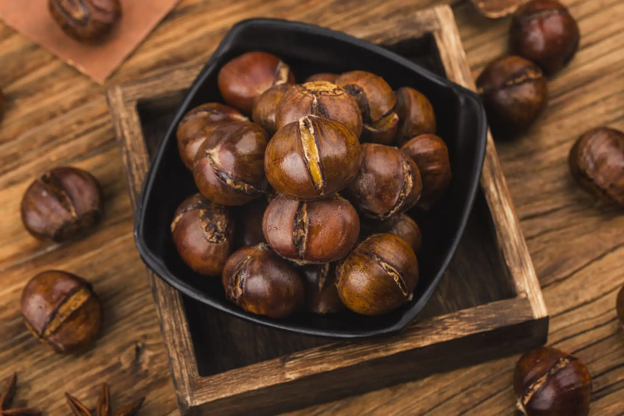 Chestnuts Wooden Background Scaled