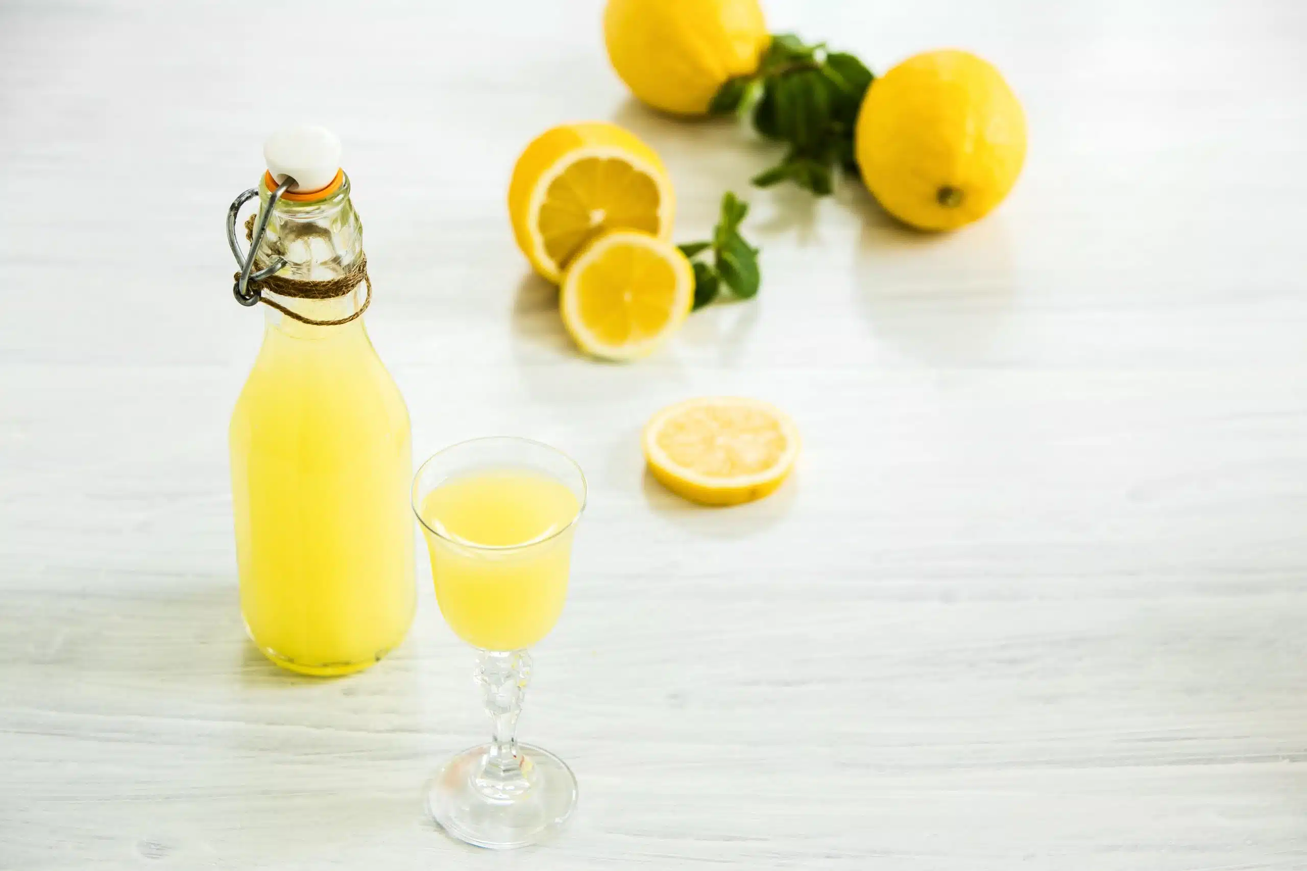 Italian Traditional Liqueur Limoncello With Lemon Scaled
