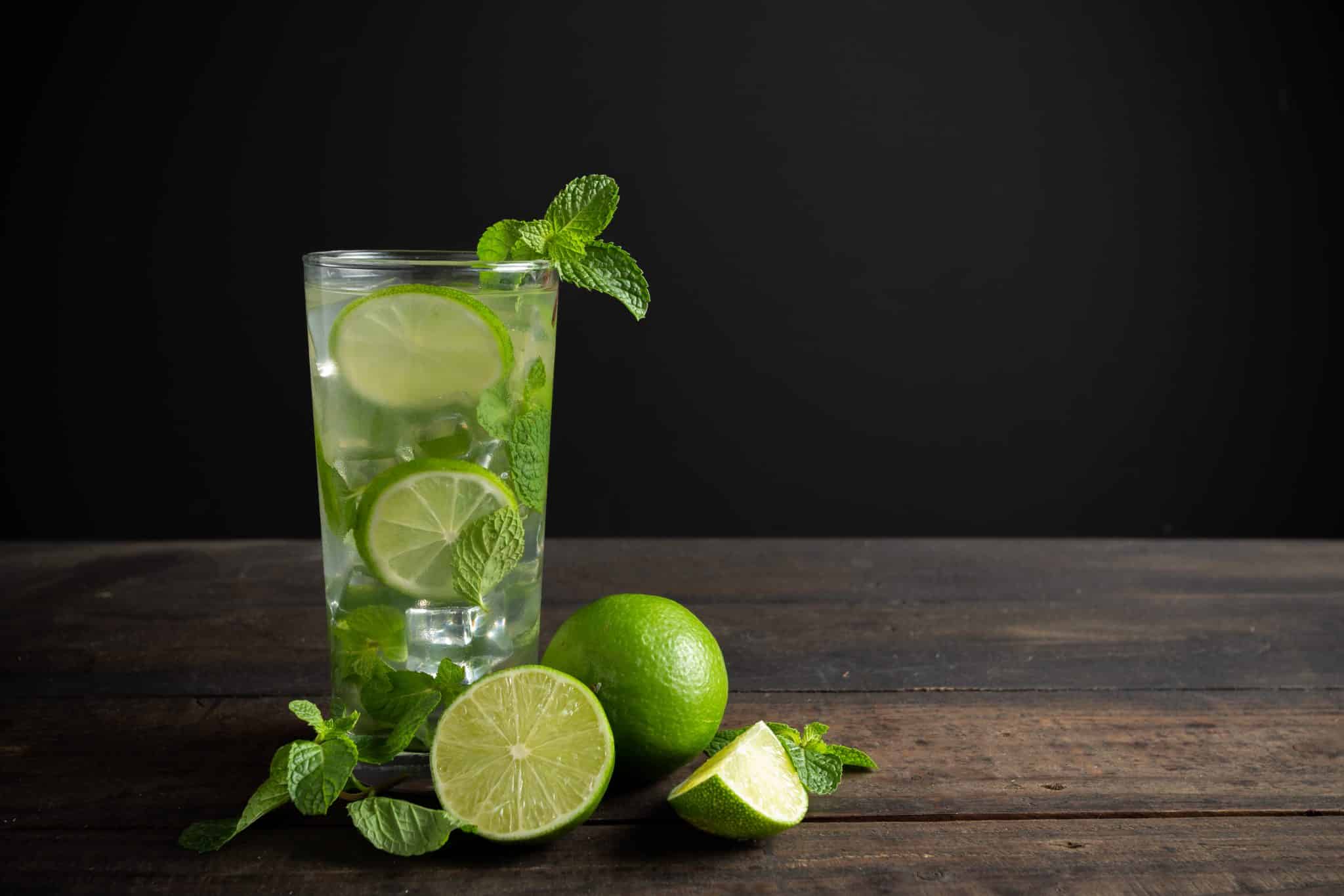 Mojito Drink With Lime Lemon And Mint On Wood Table 1 Scaled