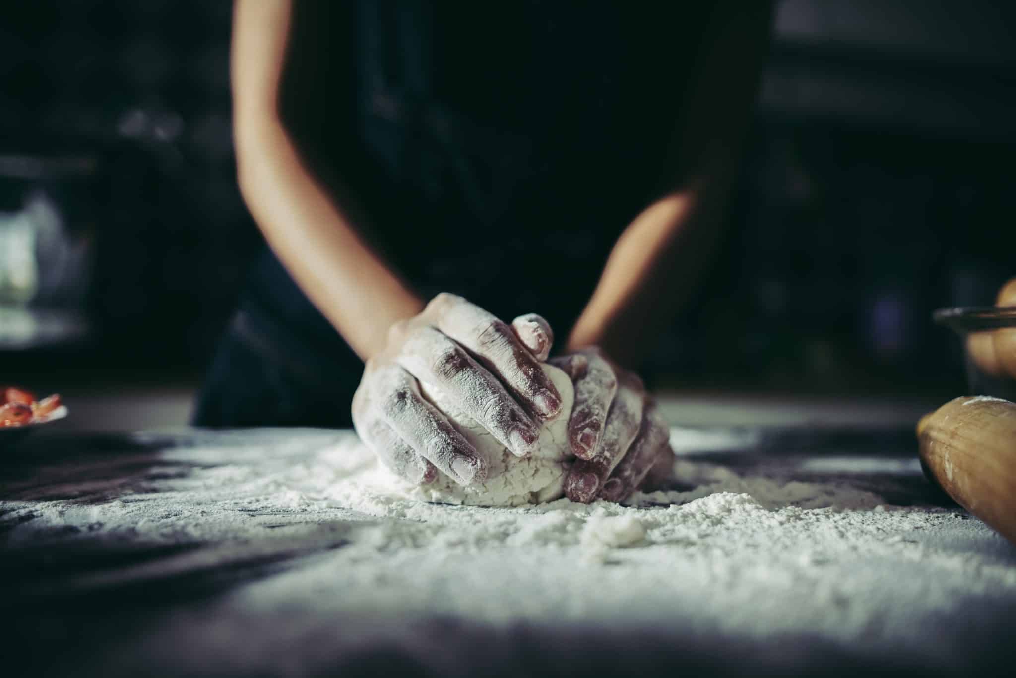 Woman Kneads Dough For Make Pizza On Wooden Cooking Concept Scaled